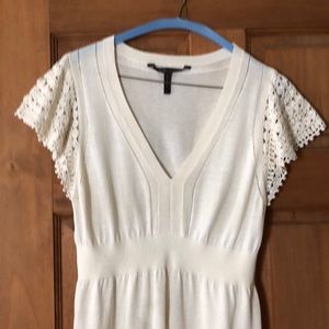BCBG silk top with crochet sleeves and trim